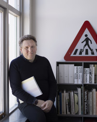 Portrait photograph of Joost Grootens in his office at the Royal Danish Academy