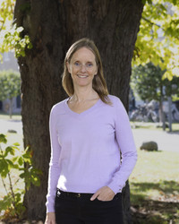 Image of woman in front of chestnut tree