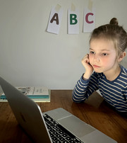 Little girl in front of computer