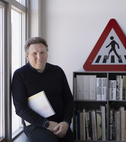 Portrait photograph of Joost Grootens in his office at the Royal Danish Academy