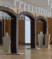 Architectural model with brick arches, timber elements, wires, and human figures.