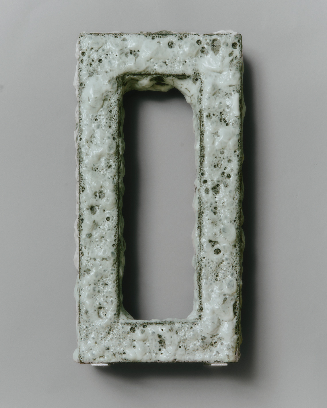 white bubbly glaze over a rectangular object