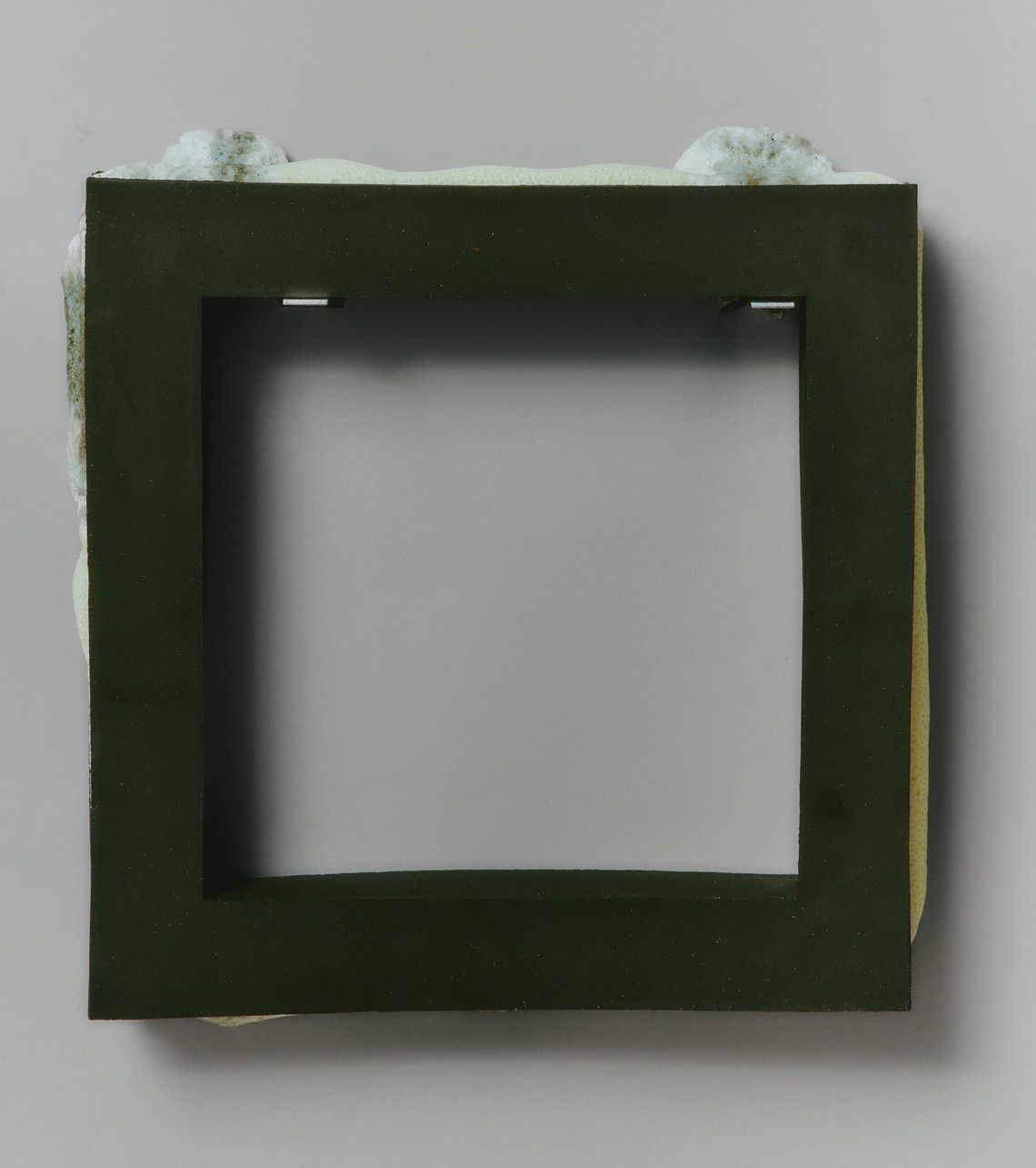 a frame with a foamy glaze on the side 
