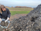 Collecting waste materials, at a local farm on the island of Bornholm.