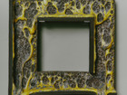 square ceramic object, yellow and grey volcanic glaze spilling over the bottom edge