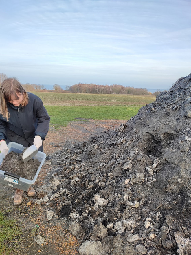 Collecting waste materials, at a local farm on the island of Bornholm.