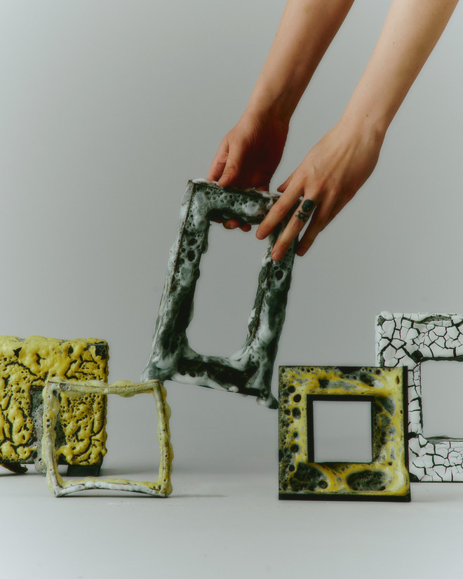 picture of 5 test frame objects, hands picking up one frame