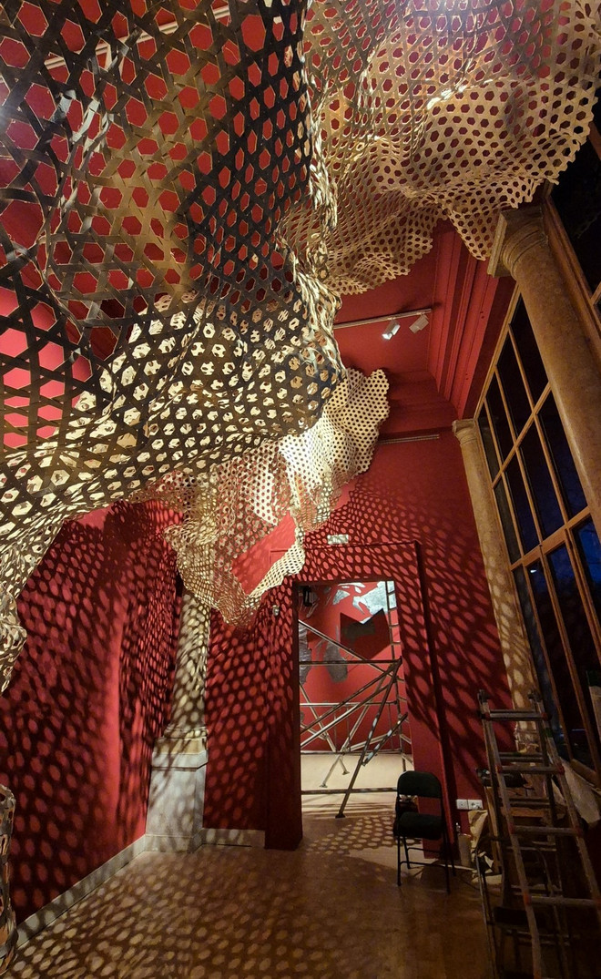 Shimoni Slave Cave Red room with weaved structure expanded from the ceiling and on walls