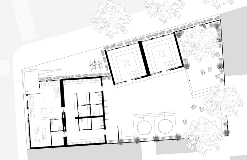 Site plan of the proposed neighbourhood sauna showing the entrance pavilion, changing facilities, sauna modules, cooling pools and outdoor recovery courtyard integrated into an urban corner site.