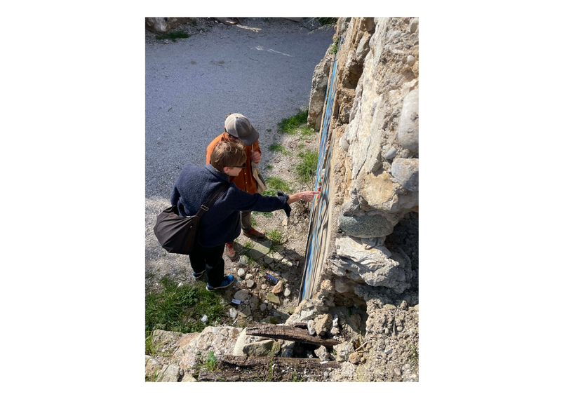 pointing at ruins