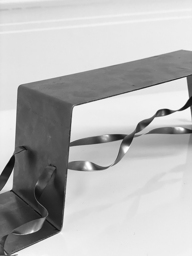 THE ROPE TRANSLATED .  SCALE MODEL OF A STEEL BENCH . ORIGINATING FROM THE PORTIKUS MOTIF  