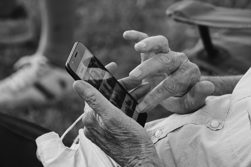Elder person using smartphone.