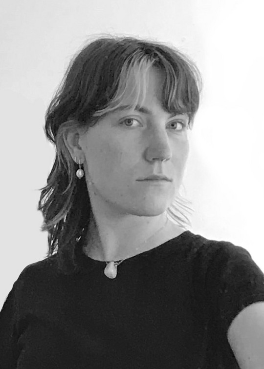 Black and white headshot of Emilie.