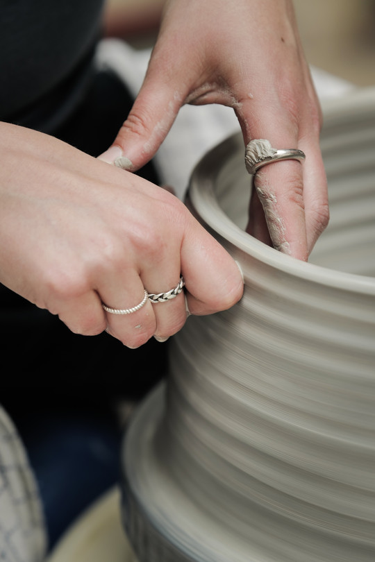 Close up: throwing on the wheel