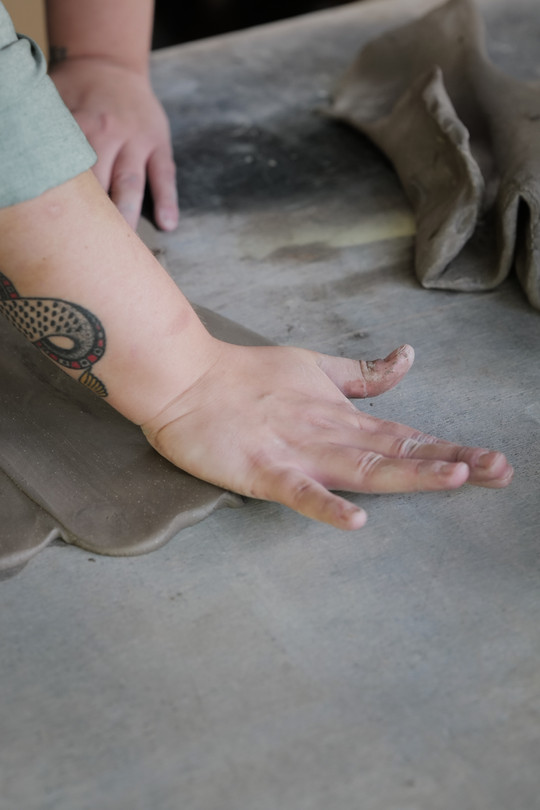 flattening slabs with hands 
