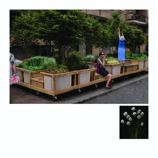 Modular planters with trees and flowers form a green seating area along an urban street.