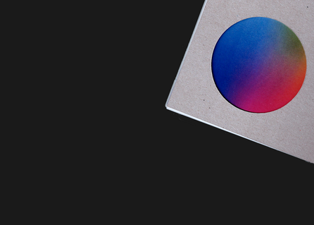 A pikabu in the top right corner of cover of the book - just seeing the circle cutout and rainbow gradient underneath