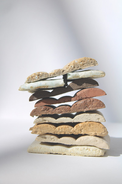 A color palette of stacked clay test, made from using waste resources . New aesthetics , tactility and expression. 