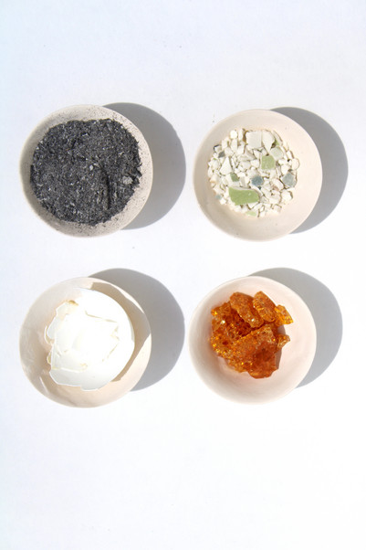 Ashes, crushed ceramic waste, eggshells and glass.