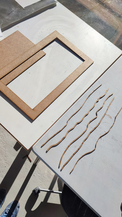 Lasercut tools in wood, used for making and designing the cladding. 