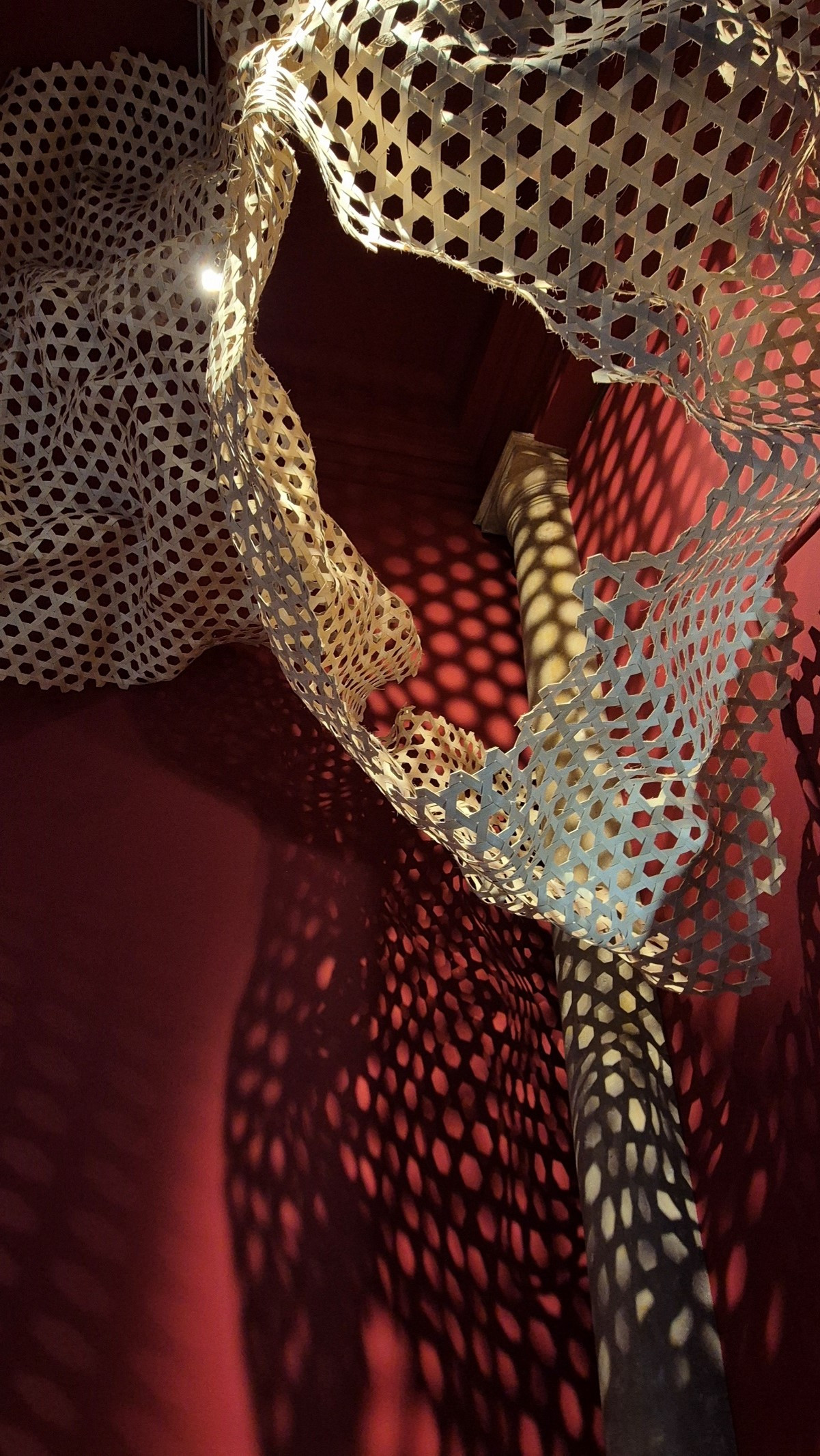 Shimoni Slave Cave Detail: Red room with weaved structure expanded from the ceiling and on walls