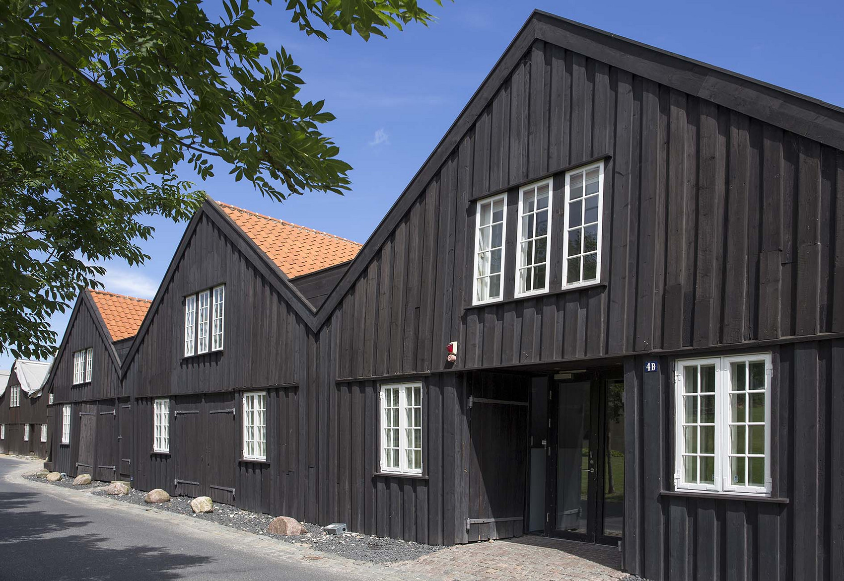kanonbådsskure i træ 